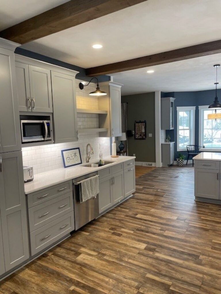 Modern farmhouse kitchen with gray cabinets, white subway tile and open shelving by Kitchen Express, Syracuse NY