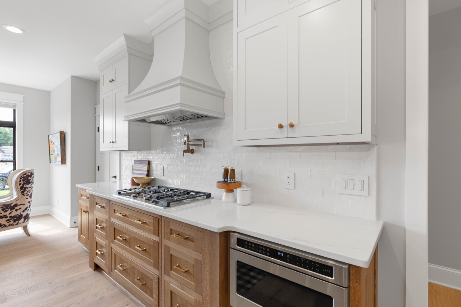 The Stone Hammer Kitchen — Stainless range and white hood