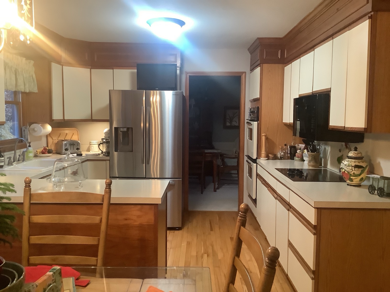 Dated white-and-oak kitchen before the Kitchen Express remodel