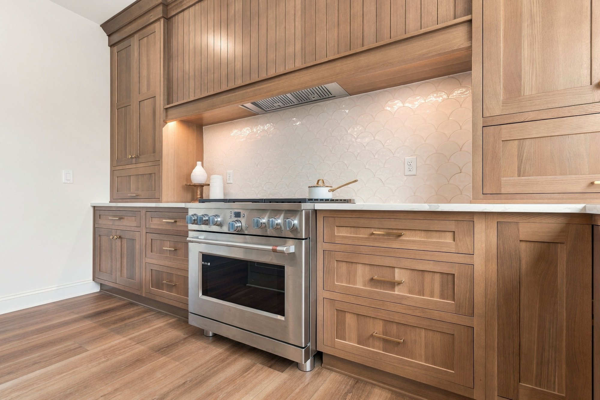 Cordelle Custom Homes 2026 Parade of Homes — Pro range with custom wood hood