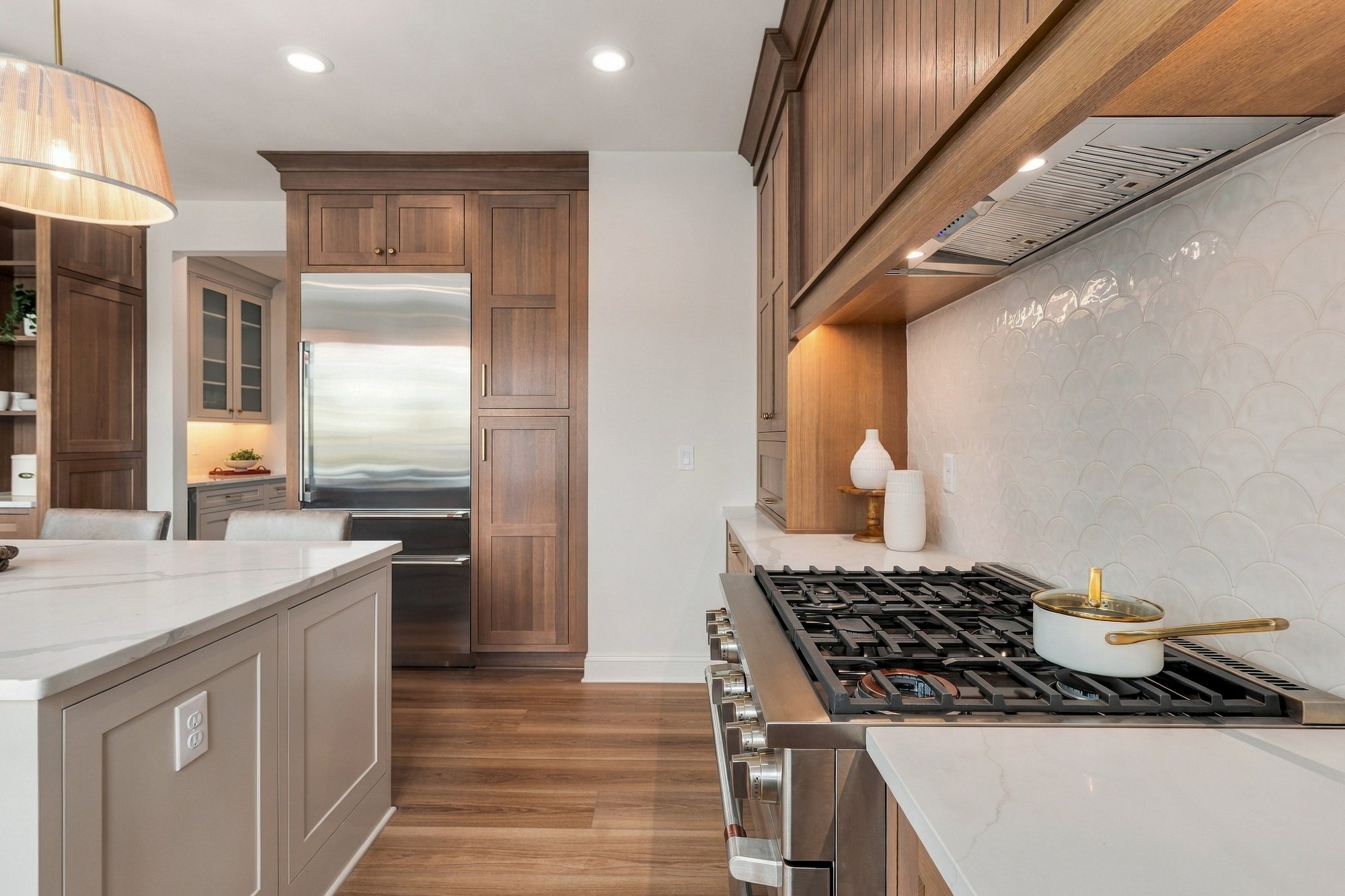 Cordelle Custom Homes 2026 Parade of Homes — Island, range, and prep space