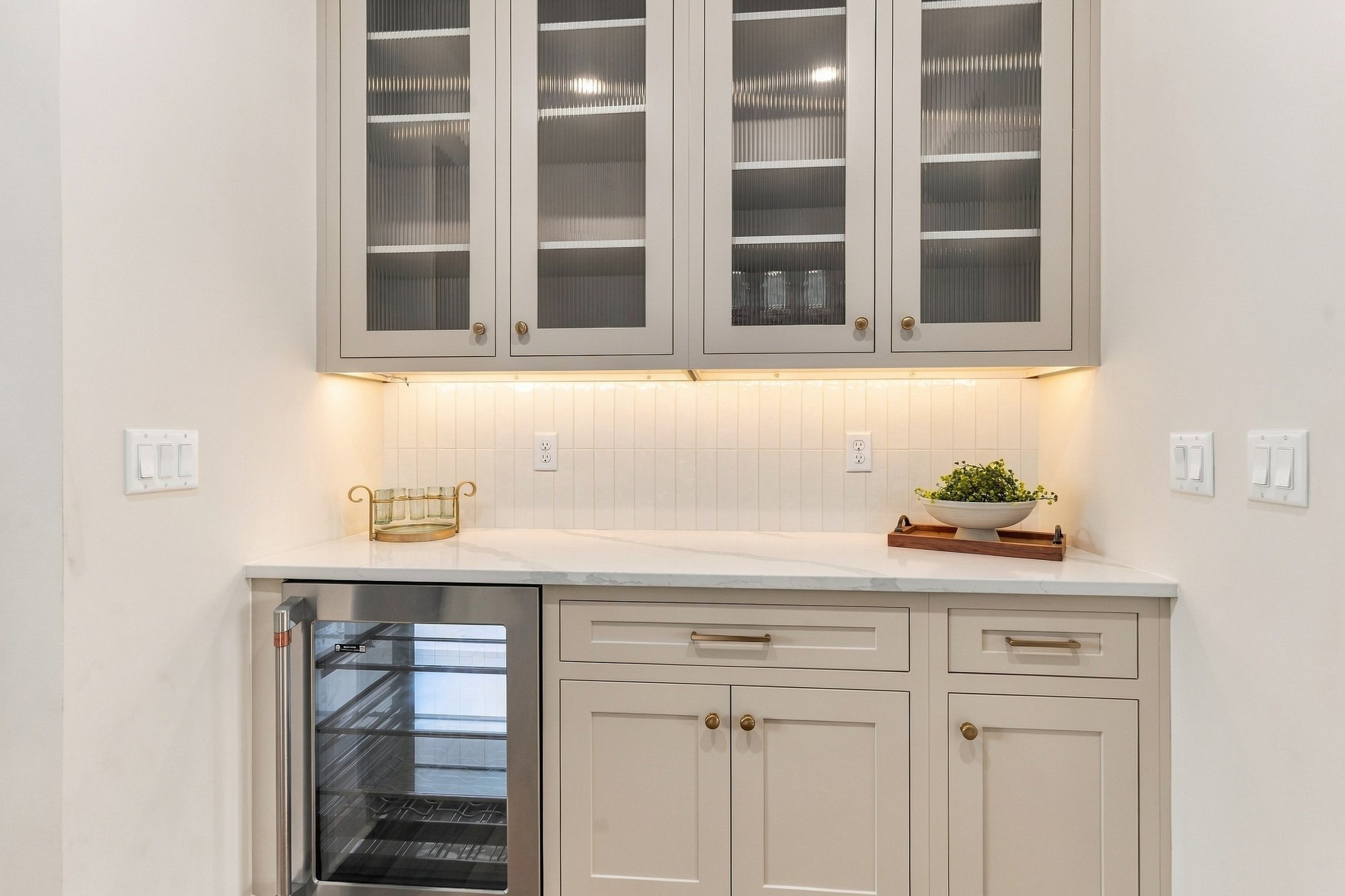 Cordelle Custom Homes 2026 Parade of Homes — Beverage center and glass display