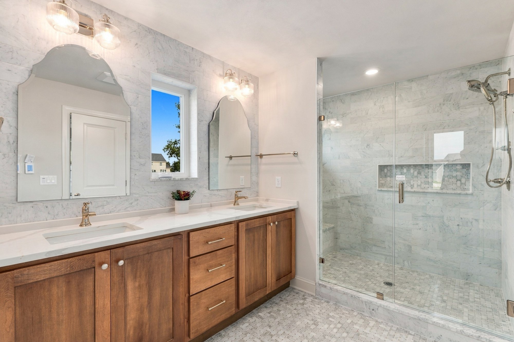 Cordelle Custom Homes 2026 Parade of Homes — Primary bath — vanity and walk-in shower