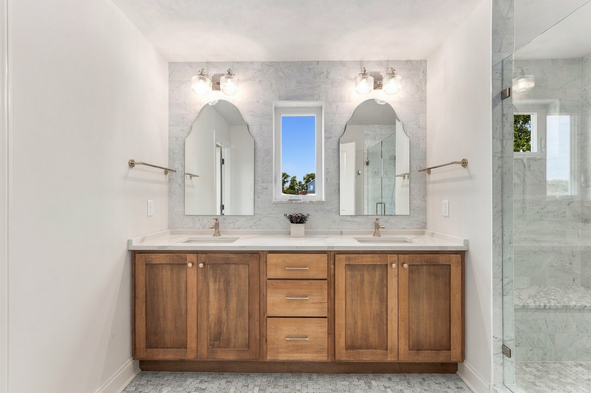Cordelle Custom Homes 2026 Parade of Homes — Double vanity with wood cabinetry