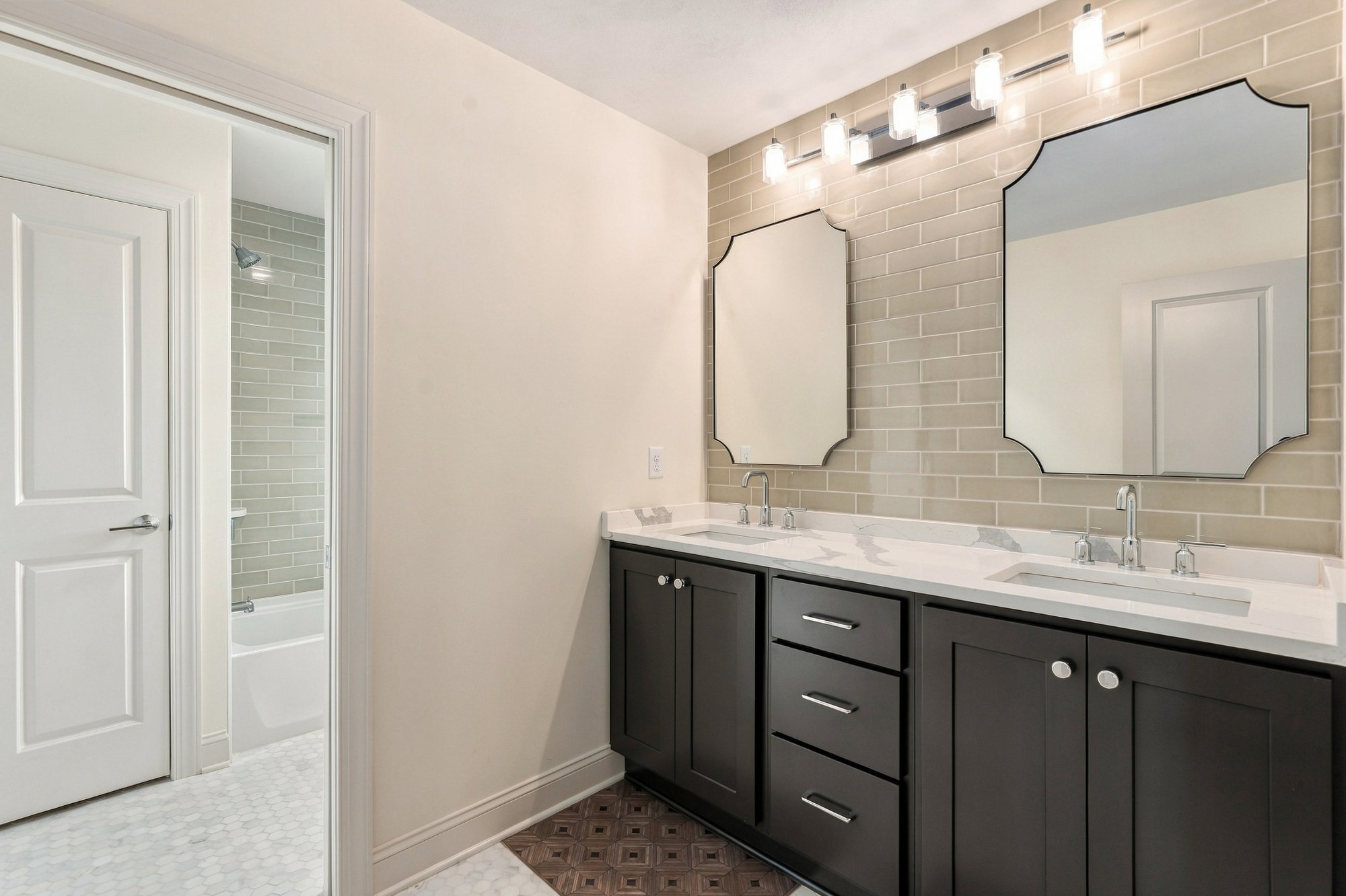 Cordelle Custom Homes 2026 Parade of Homes — Secondary bath — dark-stained vanity