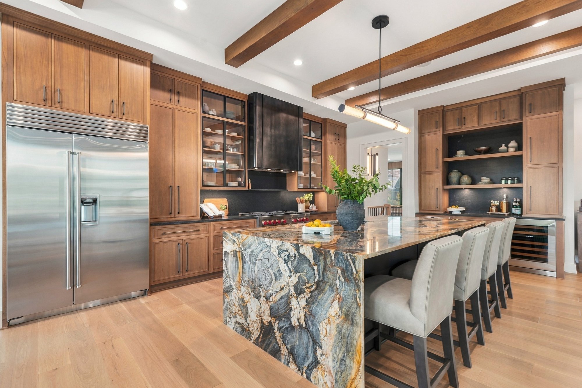 Exhale 2026 Parade Home — Dramatic island and pro-grade range