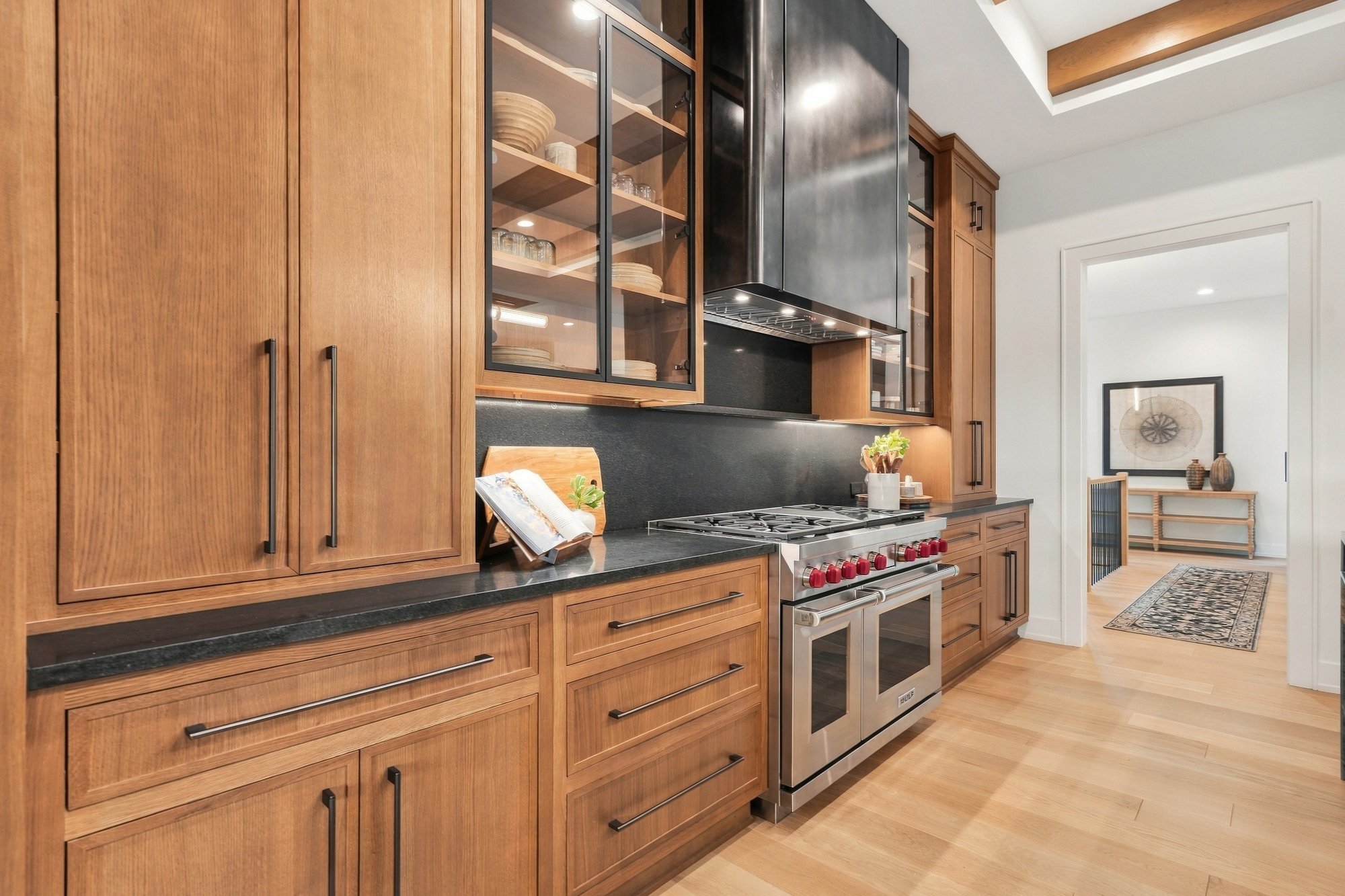 Exhale 2026 Parade Home — Long galley view to the dining room