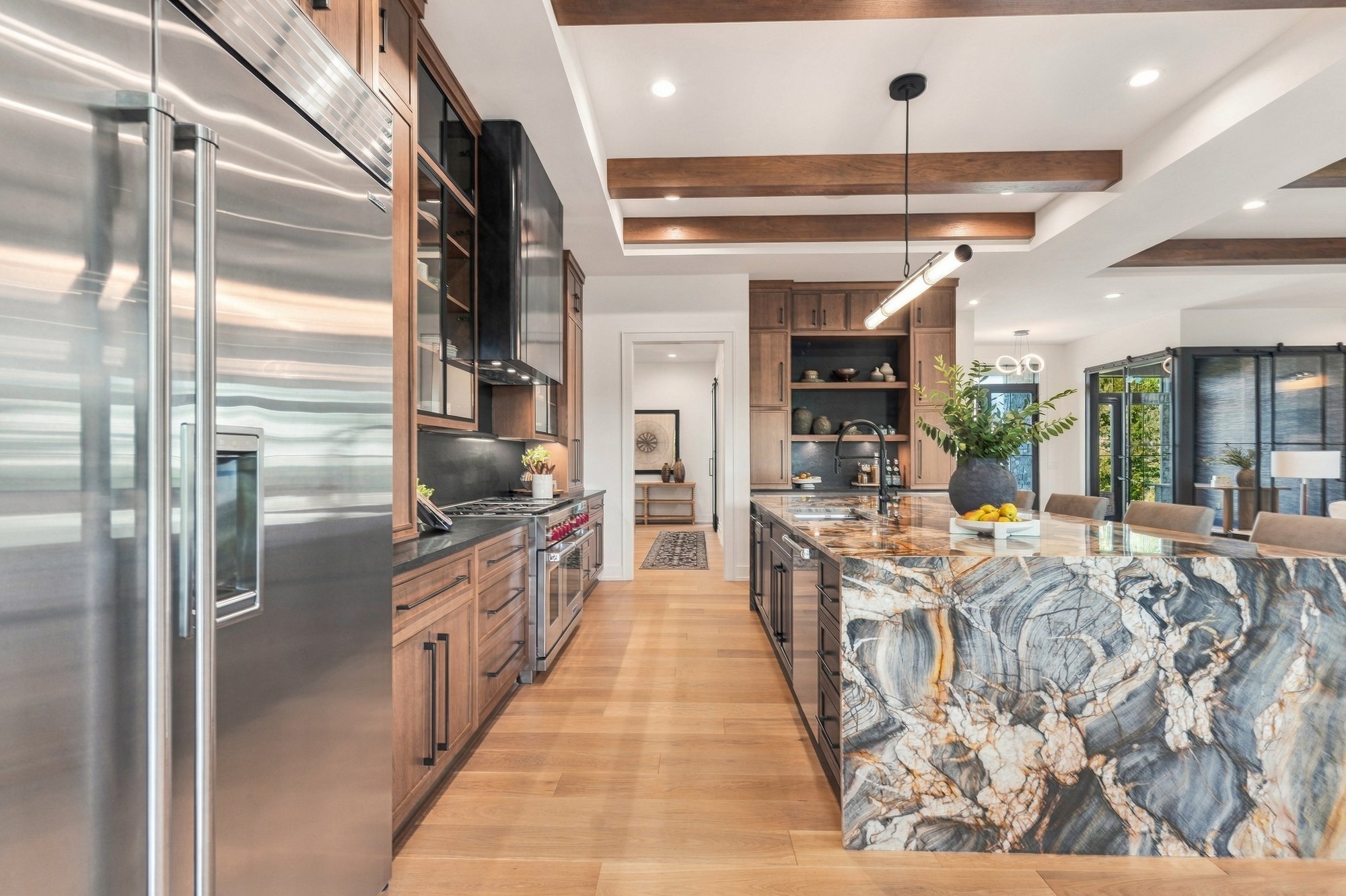 Exhale 2026 Parade Home — Pro range and dramatic black backsplash